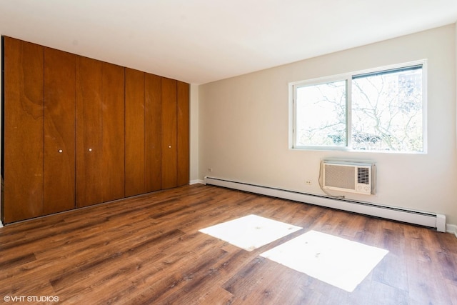 401 W Webster Ave Unit 509, Chicago, IL 60614 - unfurnished bedroom with baseboard heating, a closet, wood finished floors, and baseboards