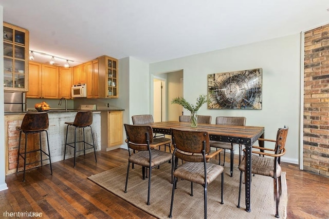 401 W Webster Ave Unit 509, Chicago, IL 60614 - dining space with dark wood-style floors and baseboards