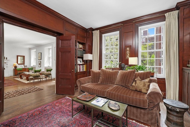 232 E Walton Pl Unit 3W, Chicago, IL 60611 - living area featuring crown molding, wood finished floors, and wood walls