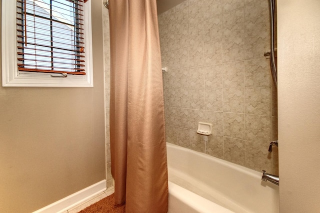 25451 Regent Blvd, Shorewood, IL 60404 - bathroom featuring baseboards and shower / bath combo