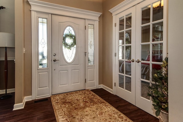 25451 Regent Blvd, Shorewood, IL 60404 - entryway with french doors, dark wood-style floors, and baseboards