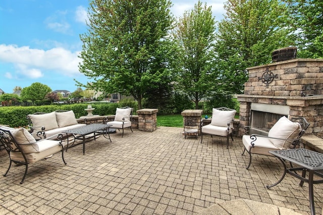 25451 Regent Blvd, Shorewood, IL 60404 - view of patio / terrace featuring an outdoor living space with a fireplace
