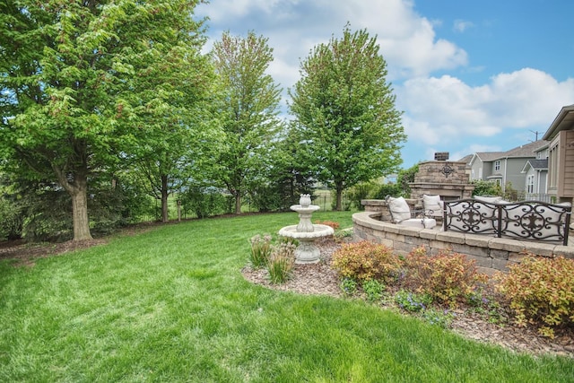 25451 Regent Blvd, Shorewood, IL 60404 - view of grassy yard with an outdoor stone fireplace