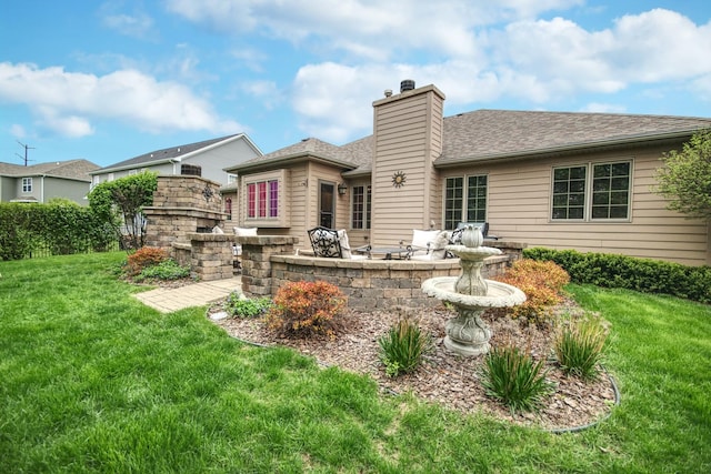 25451 Regent Blvd, Shorewood, IL 60404 - rear view of property featuring a chimney, a yard, a patio, roof with shingles, and an outdoor living space