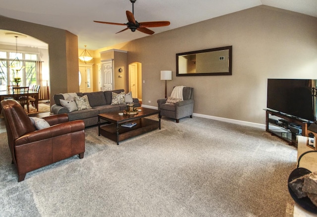 25451 Regent Blvd, Shorewood, IL 60404 - carpeted living area featuring arched walkways, a ceiling fan, baseboards, lofted ceiling, and a chandelier