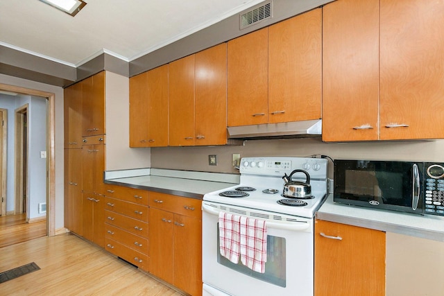 807 S Main St, Belvidere, IL 61008 - kitchen with electric stove, under cabinet range hood, black microwave, light wood-type flooring, and brown cabinets