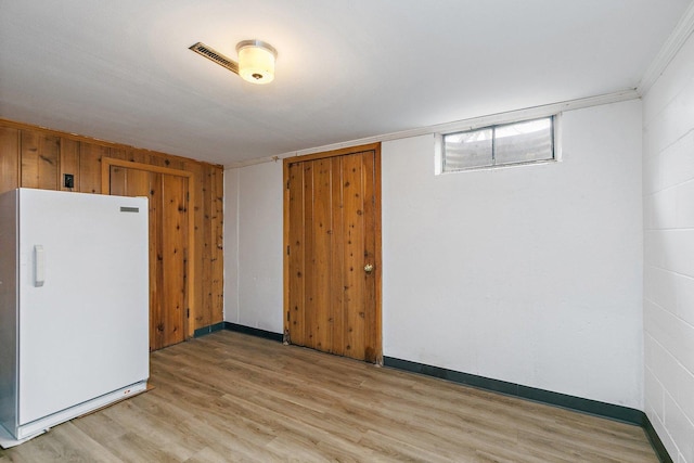 807 S Main St, Belvidere, IL 61008 - below grade area featuring freestanding refrigerator and light wood-style floors