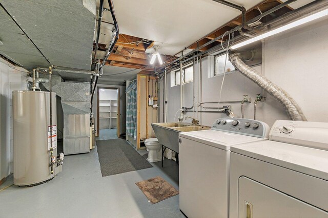 807 S Main St, Belvidere, IL 61008 - laundry area with gas water heater, washing machine and dryer, and heating unit