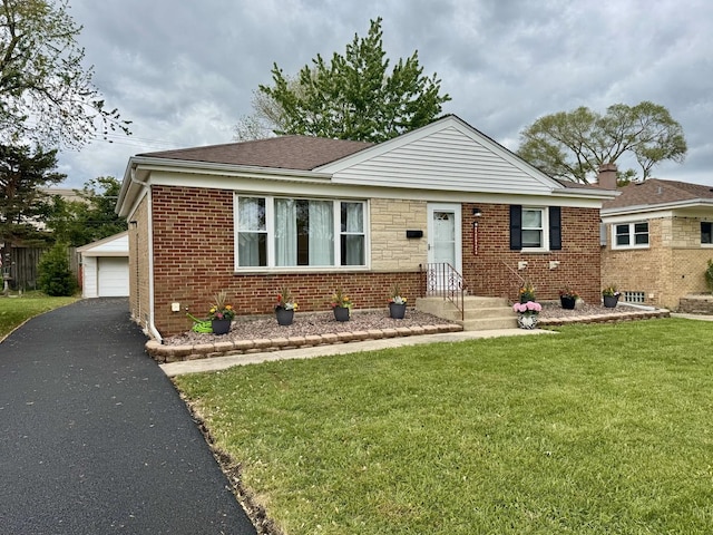 2122 Mandel Ave, Westchester, IL 60154 - view of front of home featuring brick siding, a garage, an outdoor structure, a front lawn, and roof with shingles