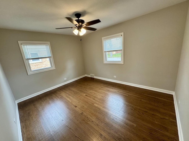 2122 Mandel Ave, Westchester, IL 60154 - spare room with dark wood-style flooring, baseboards, and a ceiling fan