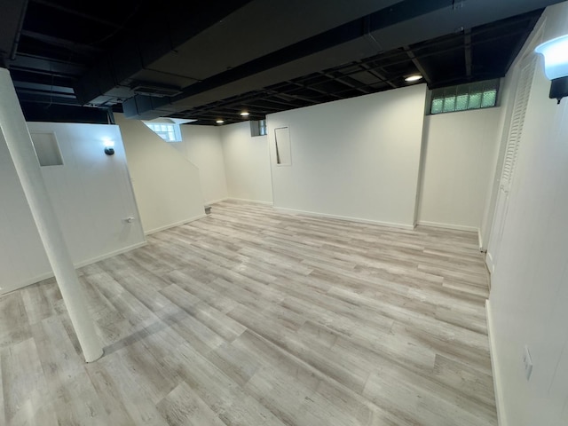 2122 Mandel Ave, Westchester, IL 60154 - below grade area with wood finished floors and baseboards