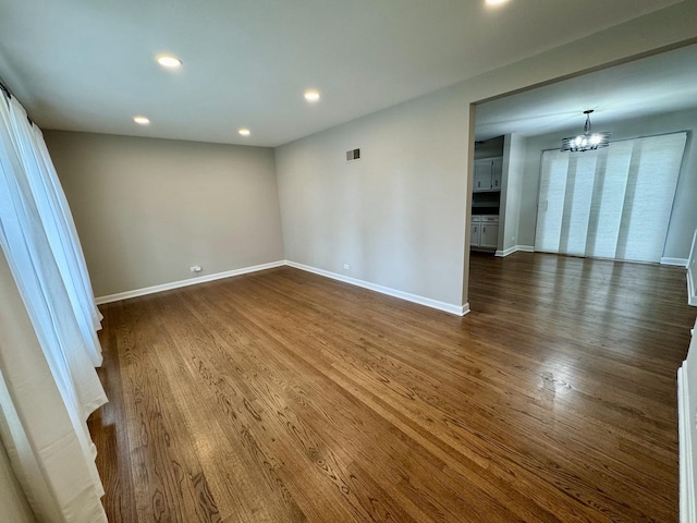 2122 Mandel Ave, Westchester, IL 60154 - spare room featuring a chandelier, dark wood-type flooring, baseboards, and recessed lighting
