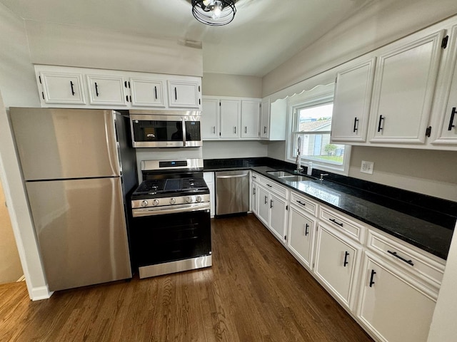 2122 Mandel Ave, Westchester, IL 60154 - kitchen with appliances with stainless steel finishes, dark wood-style floors, white cabinets, and a sink