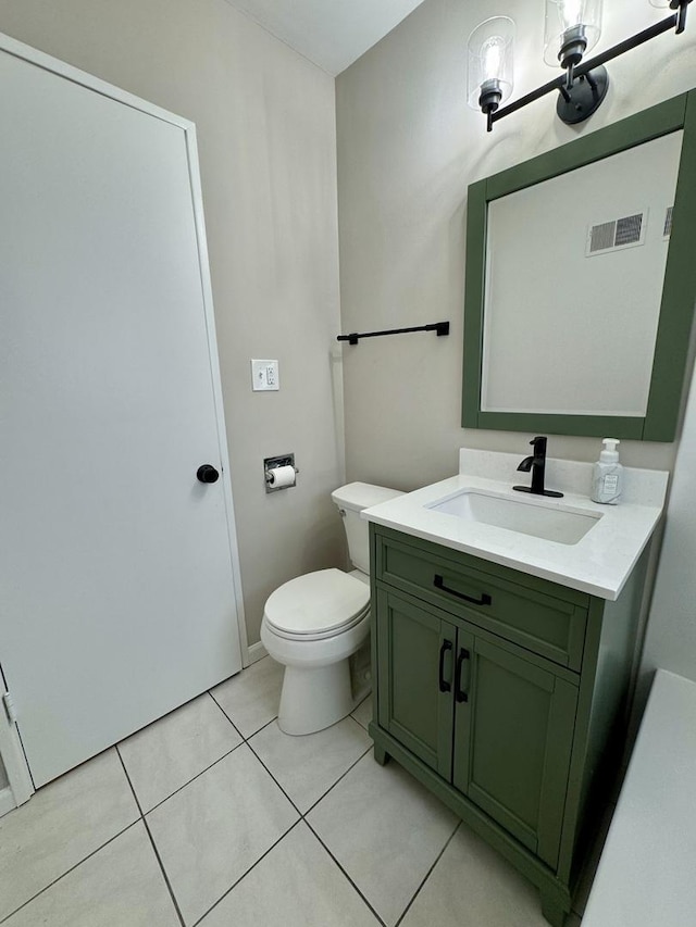 2122 Mandel Ave, Westchester, IL 60154 - bathroom featuring vanity, toilet, tile patterned floors, and baseboards