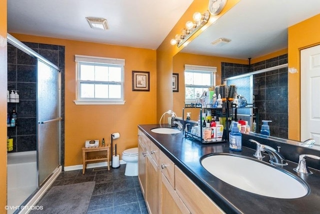 9675 Newton Rd, Huntley, IL 60142 - full bathroom featuring a shower stall, double vanity, and tile patterned floors