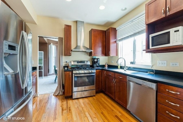9675 Newton Rd, Huntley, IL 60142 - kitchen featuring appliances with stainless steel finishes, wall chimney exhaust hood, dark countertops, light wood-type flooring, and recessed lighting