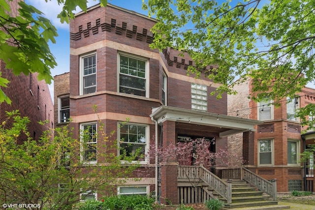 3624 N Leavitt St, Chicago, IL 60618 - view of front of property featuring brick siding and a porch
