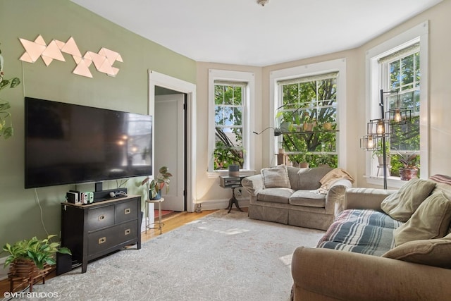 3624 N Leavitt St, Chicago, IL 60618 - living area featuring plenty of natural light, wood finished floors, and baseboards