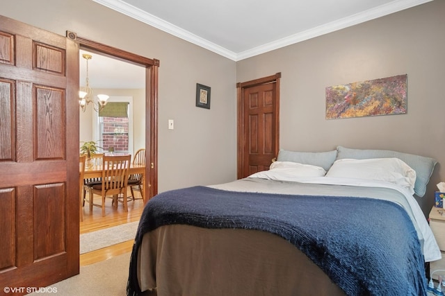 3624 N Leavitt St, Chicago, IL 60618 - bedroom featuring a chandelier, wood finished floors, and crown molding