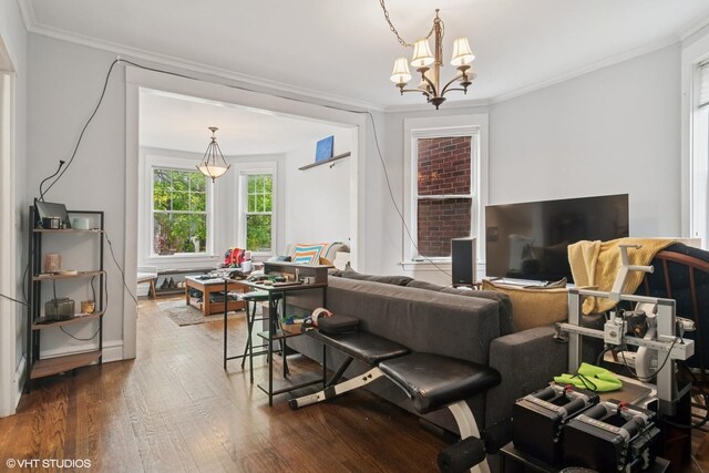 3624 N Leavitt St, Chicago, IL 60618 - living room featuring dark wood finished floors, a chandelier, and crown molding