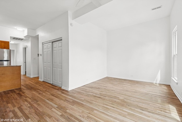2424 N Seminary Ave, Chicago, IL 60614 - unfurnished living room featuring light wood finished floors and baseboards