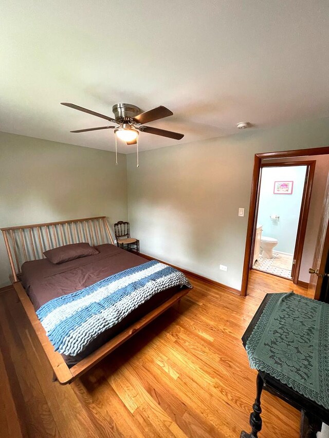 5941 W 99th St, Oak Lawn, IL 60453 - bedroom with light wood-style floors, baseboards, and ceiling fan