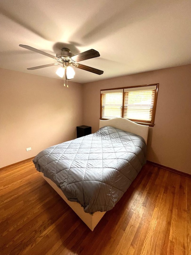 5941 W 99th St, Oak Lawn, IL 60453 - bedroom with wood finished floors, baseboards, and ceiling fan
