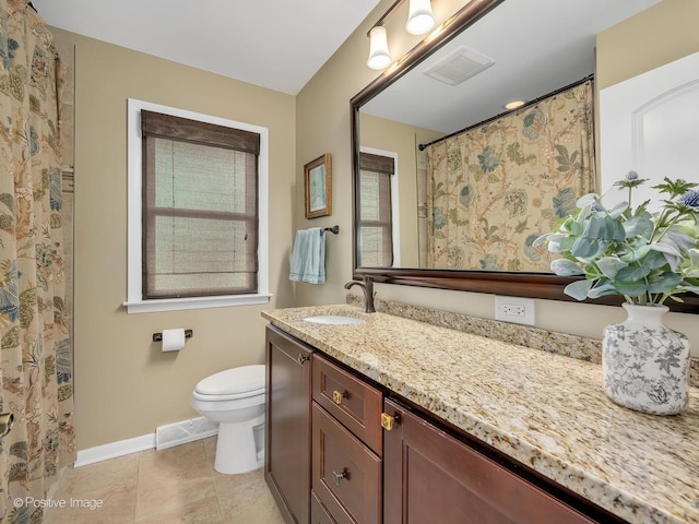full bathroom featuring baseboards, toilet, vanity, and tile patterned flooring