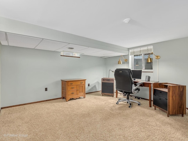 carpeted home office with baseboards