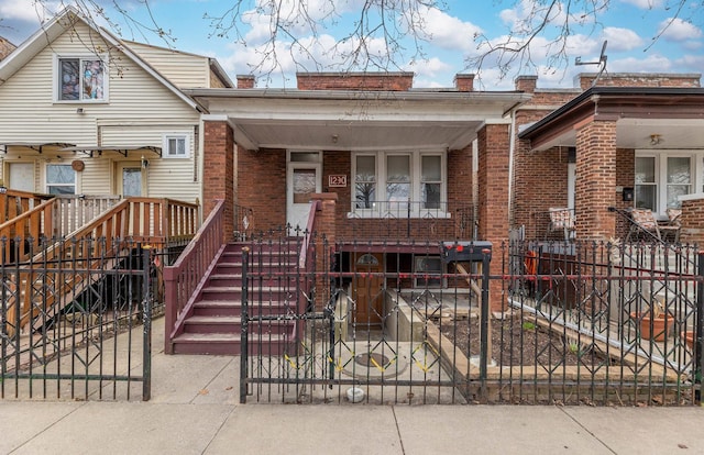 1230 S 57th Ct, Cicero, IL 60804 - view of front of house with brick siding, a fenced front yard, and a porch