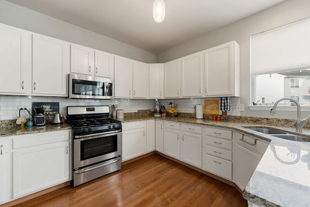 16030 Tahoe Ln, Crest Hill, IL 60403 - kitchen with stainless steel appliances, a sink, and white cabinets
