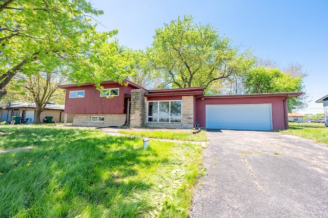 1513 Rickey Dr, Joliet, IL 60433 - split level home featuring asphalt driveway and a garage