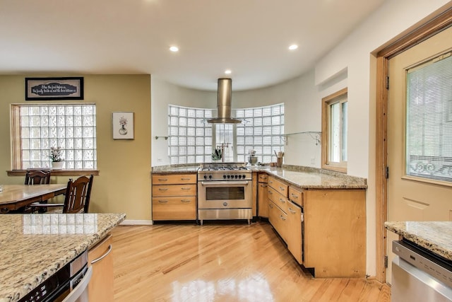 6911 N Wildwood Ave, Chicago, IL 60646 - kitchen featuring appliances with stainless steel finishes, island range hood, light wood-style floors, light stone counters, and recessed lighting