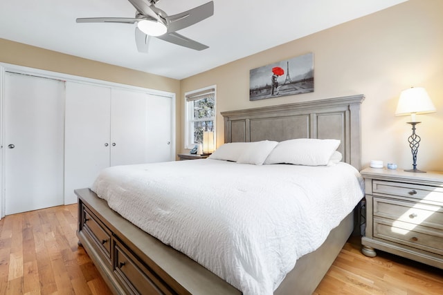 2936 Warbler Pl, Highland Park, IL 60035 - bedroom featuring a closet, light wood-type flooring, and a ceiling fan