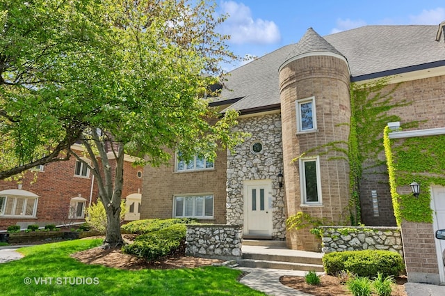 670 Ballantrae Dr Unit 900C, Northbrook, IL 60062 - view of front of home featuring stone siding, roof with shingles, and brick siding