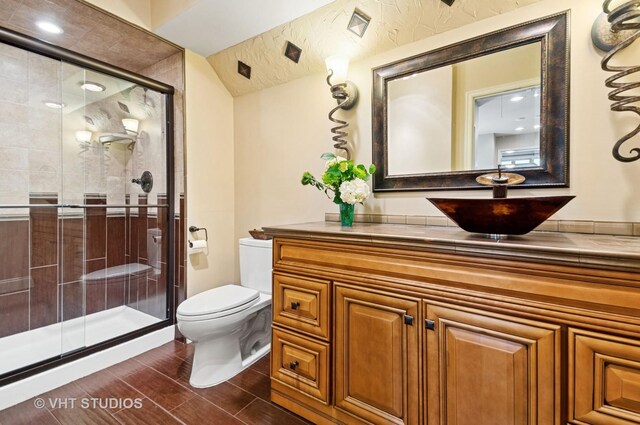 670 Ballantrae Dr Unit 900C, Northbrook, IL 60062 - bathroom with toilet, a stall shower, wood finished floors, and vanity