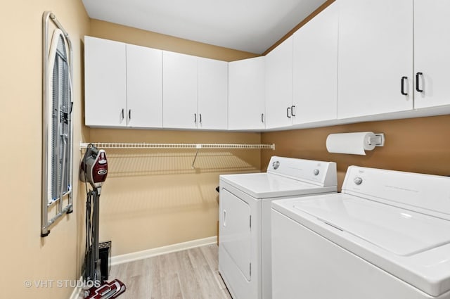 670 Ballantrae Dr Unit 900C, Northbrook, IL 60062 - washroom featuring washing machine and clothes dryer, cabinet space, light wood finished floors, and baseboards