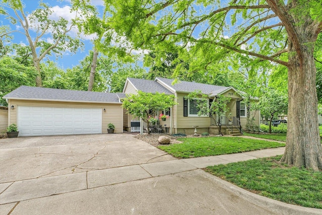 505 S Maple St, Urbana, IL 61801 - view of front of home with driveway, an attached garage, and a front yard