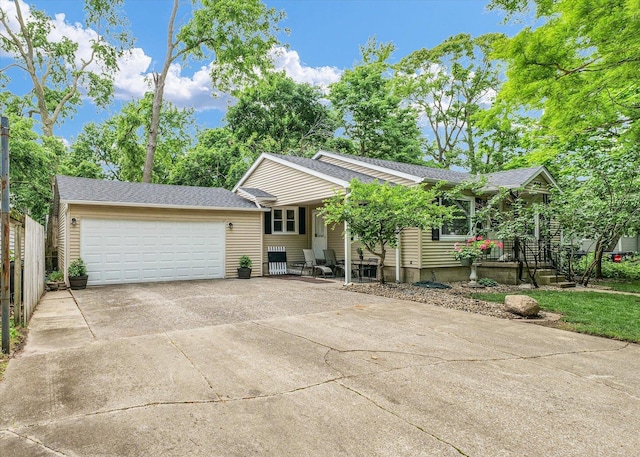 505 S Maple St, Urbana, IL 61801 - ranch-style house featuring an attached garage, driveway, and a shingled roof