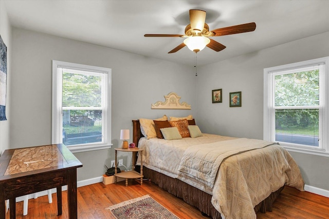 505 S Maple St, Urbana, IL 61801 - bedroom with wood finished floors, baseboards, and ceiling fan