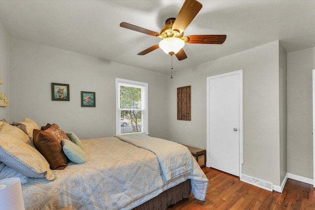 505 S Maple St, Urbana, IL 61801 - bedroom with wood finished floors, ceiling fan, and baseboards