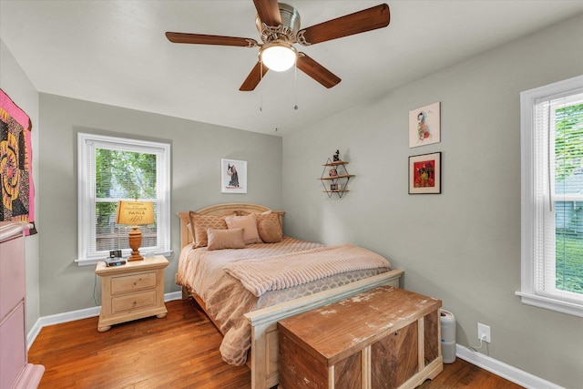 505 S Maple St, Urbana, IL 61801 - bedroom with light wood-style floors, baseboards, and a ceiling fan