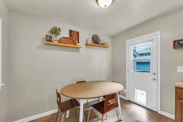 505 S Maple St, Urbana, IL 61801 - dining space with baseboards and tile patterned flooring