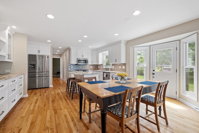 424 Dilorenzo Dr, Naperville, IL 60565 - dining space with plenty of natural light, light wood-style flooring, recessed lighting, and baseboards