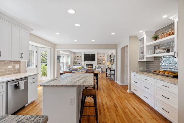 424 Dilorenzo Dr, Naperville, IL 60565 - kitchen with dishwasher, a kitchen bar, white cabinetry, tasteful backsplash, and open shelves