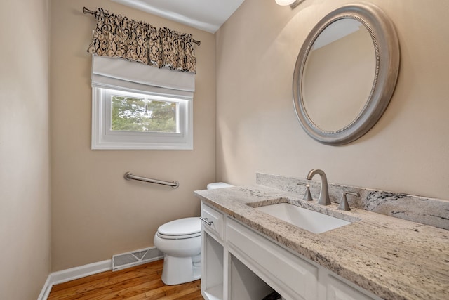 424 Dilorenzo Dr, Naperville, IL 60565 - bathroom featuring wood finished floors, toilet, vanity, and baseboards