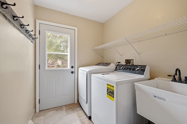 424 Dilorenzo Dr, Naperville, IL 60565 - laundry area featuring washing machine and clothes dryer, baseboards, and light stone finish floors