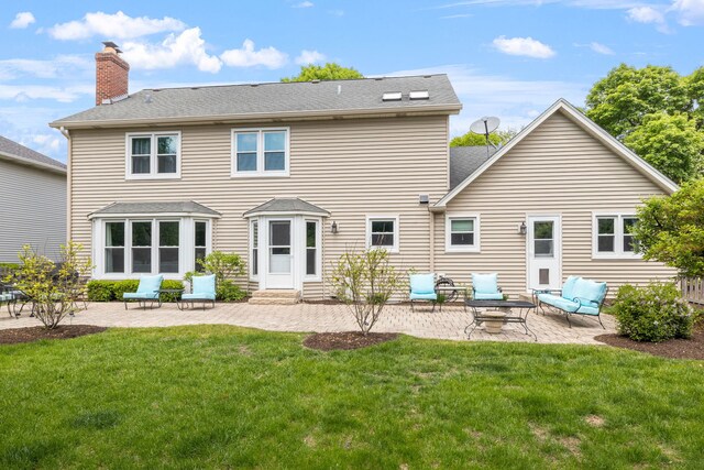 424 Dilorenzo Dr, Naperville, IL 60565 - rear view of house with a patio area, a chimney, a yard, entry steps, and roof with shingles
