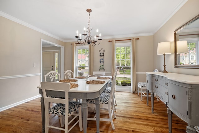 424 Dilorenzo Dr, Naperville, IL 60565 - dining room with a chandelier, light wood-style flooring, crown molding, and baseboards