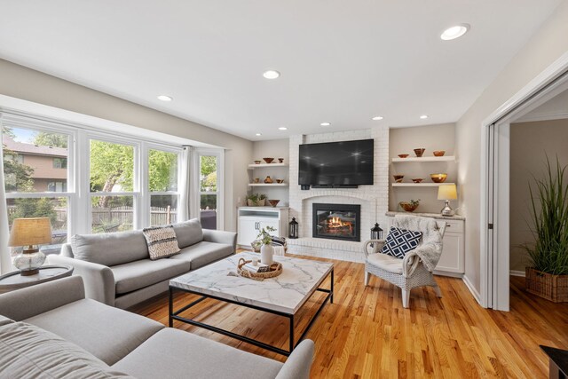 424 Dilorenzo Dr, Naperville, IL 60565 - living area with a fireplace, recessed lighting, light wood-type flooring, and baseboards